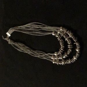 St. Thomas gray multi cord necklace with silver tone beads.